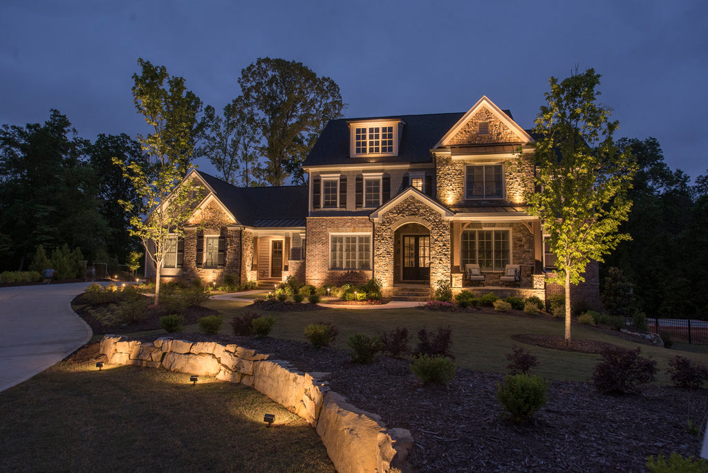 Stately house in Atlanta with low voltage outdoor lighting professionally done by contractors 